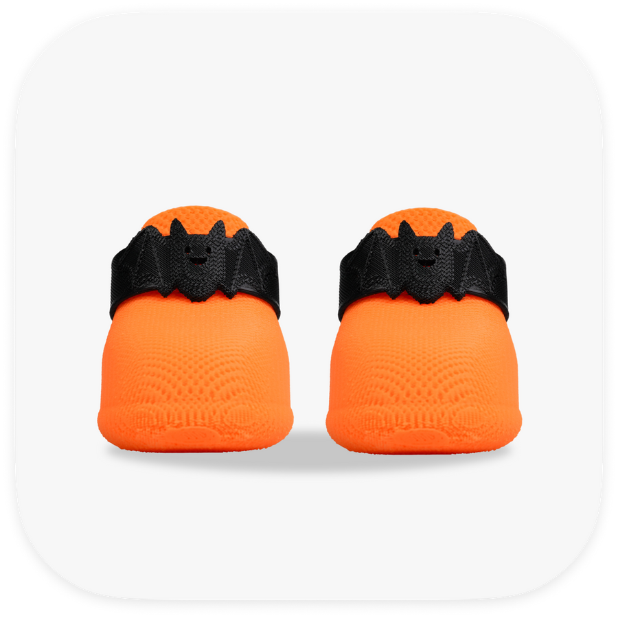 Canela ForméFit ID Halloween Bat — orange boots with a black bat strap, front view